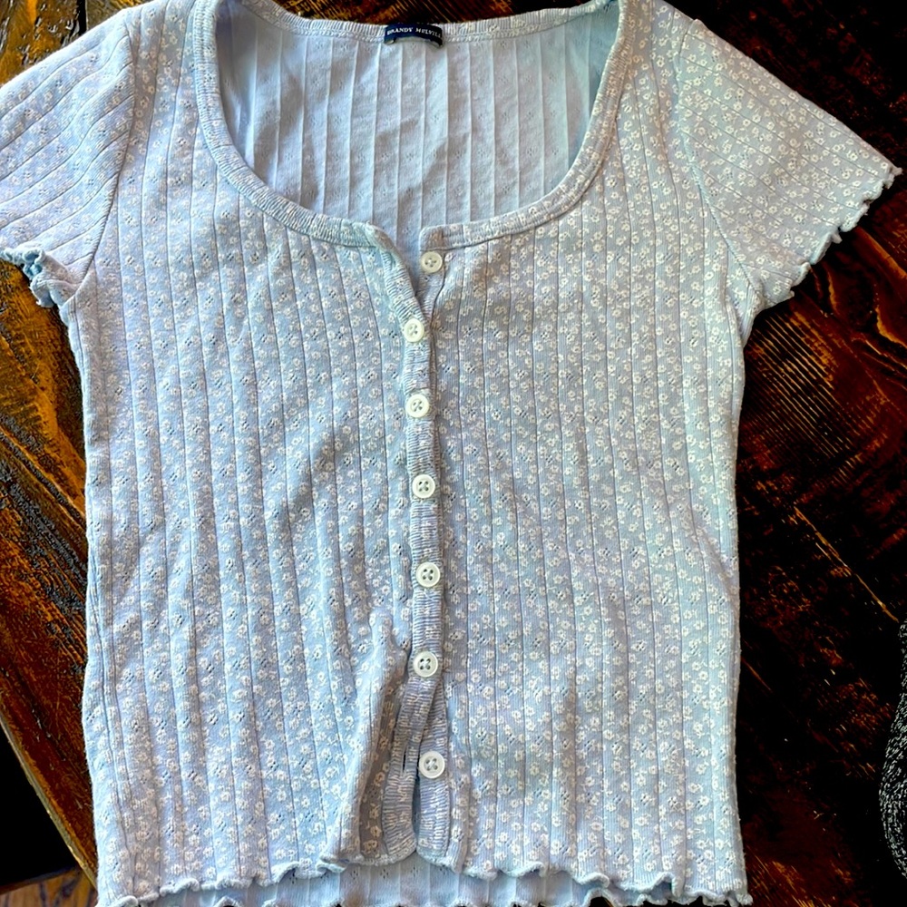 Floral eyelet top. Light blue with white.